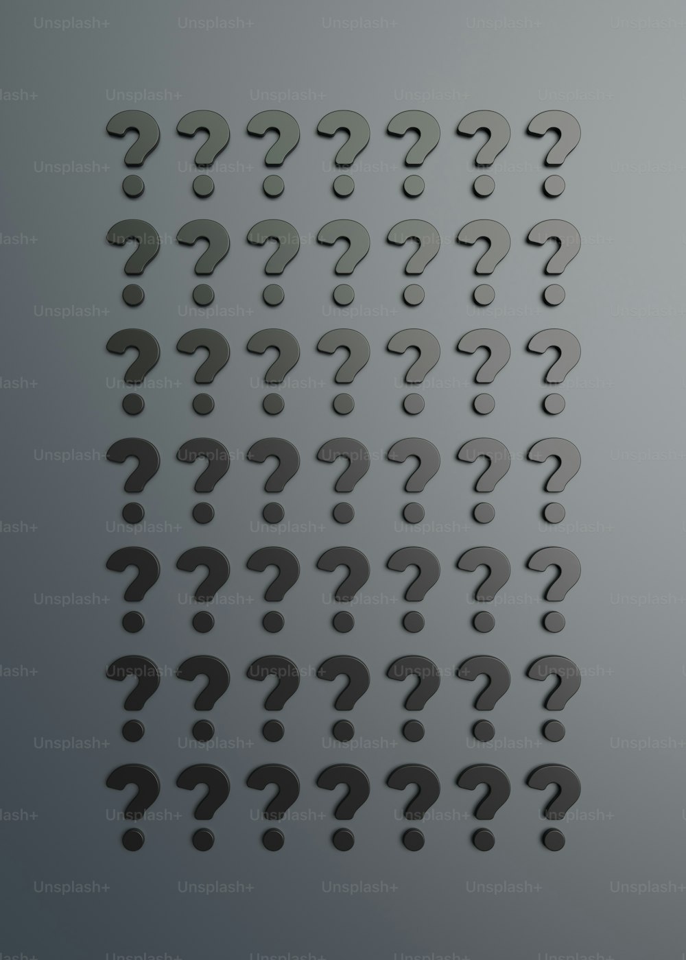 a number of question marks on a gray background