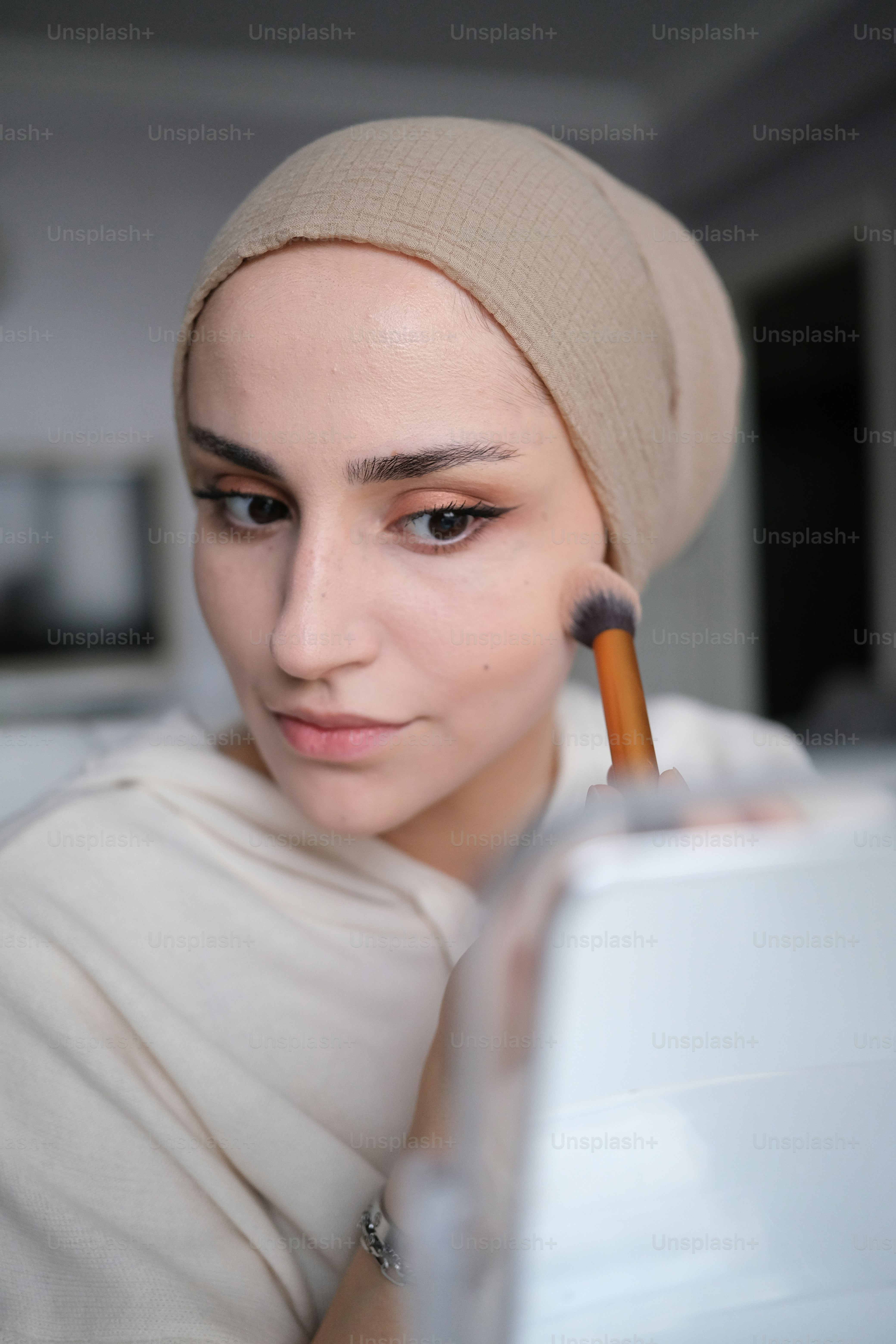 a woman with a pencil in her mouth