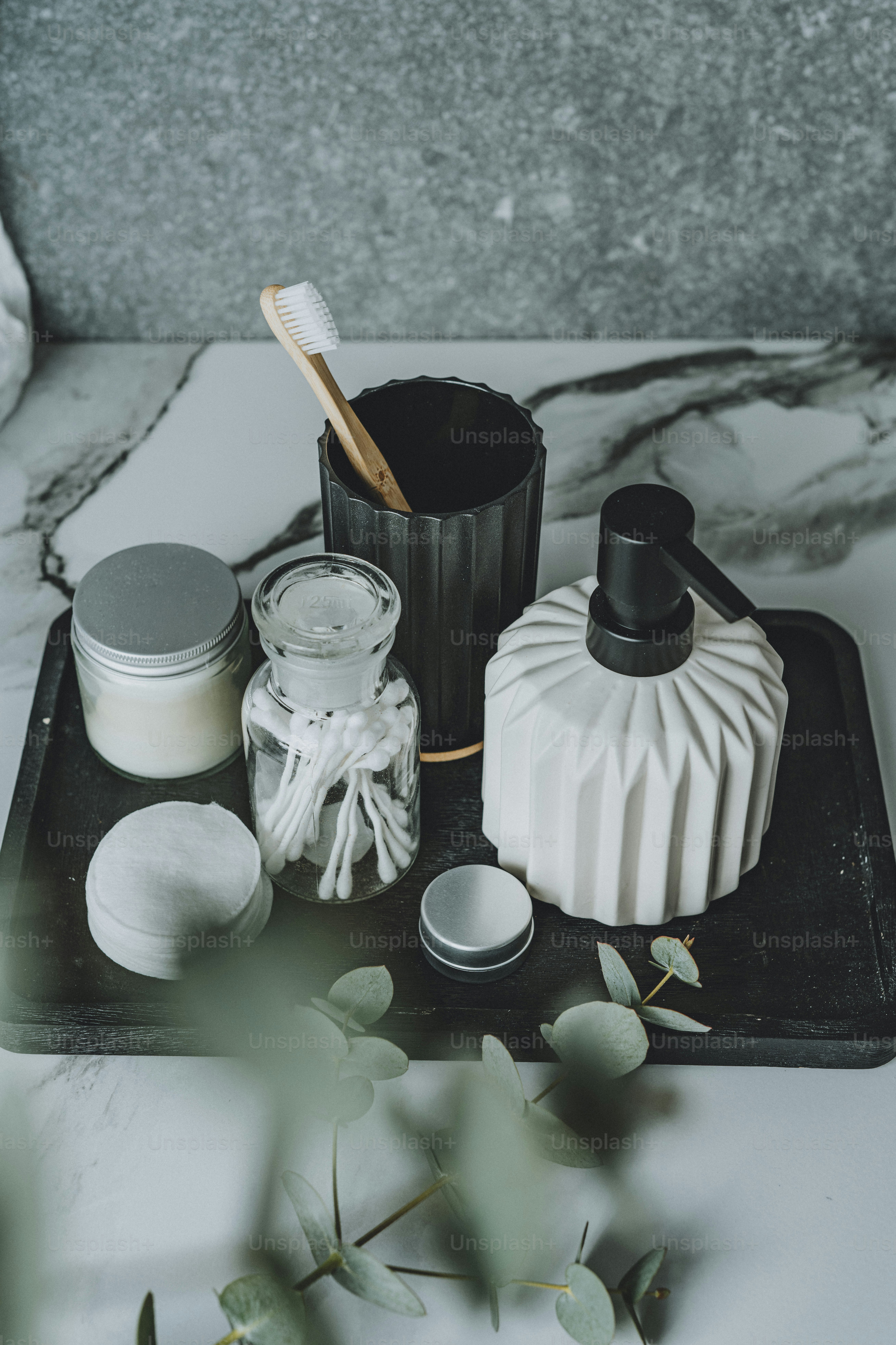 a tray with a toothbrush, cream, and other items on it