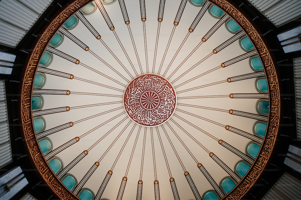 the ceiling of a building has a circular design on it