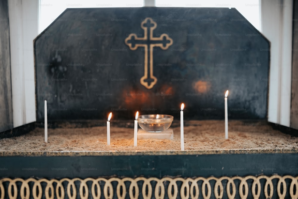 a church altar with candles and a crucifix
