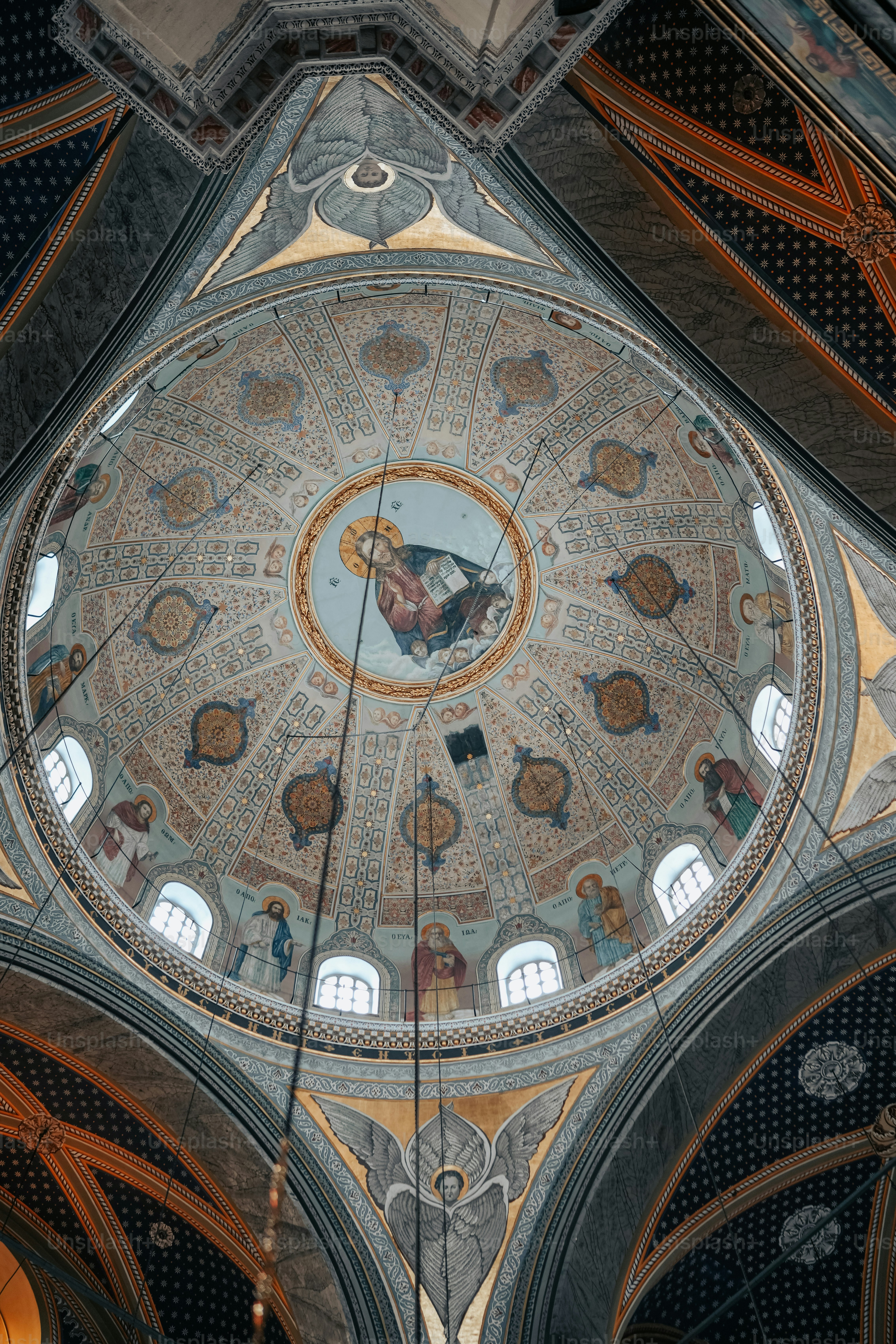 the ceiling of a church with a painting on it