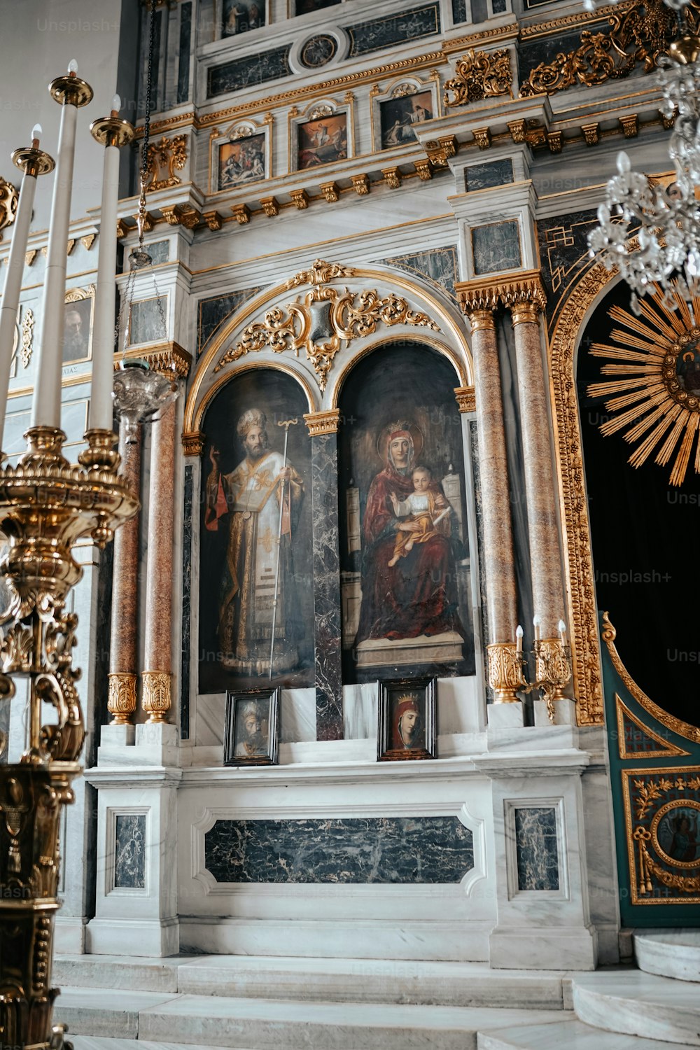 a church altar with paintings on the walls