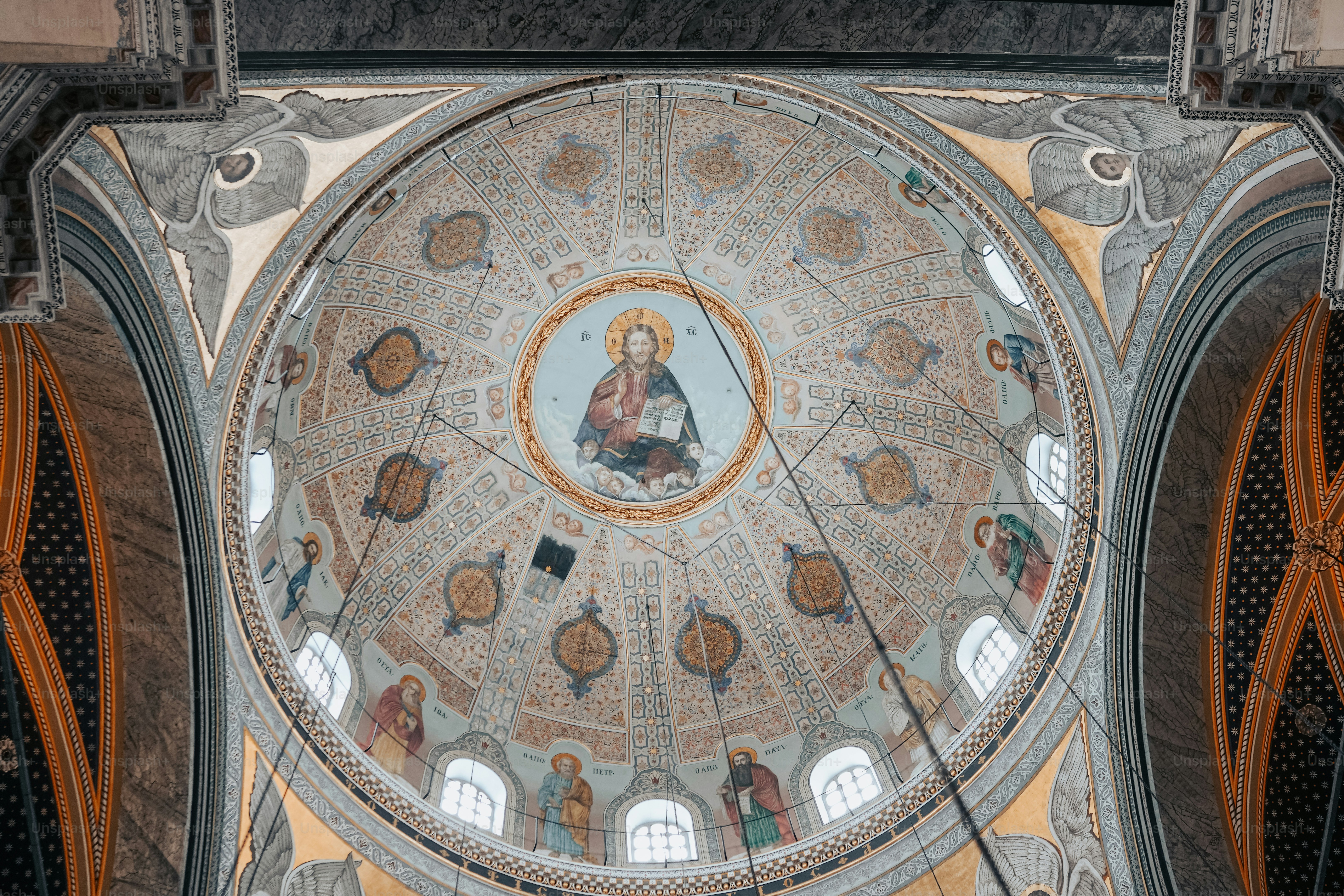 the ceiling of a church with a painting on it