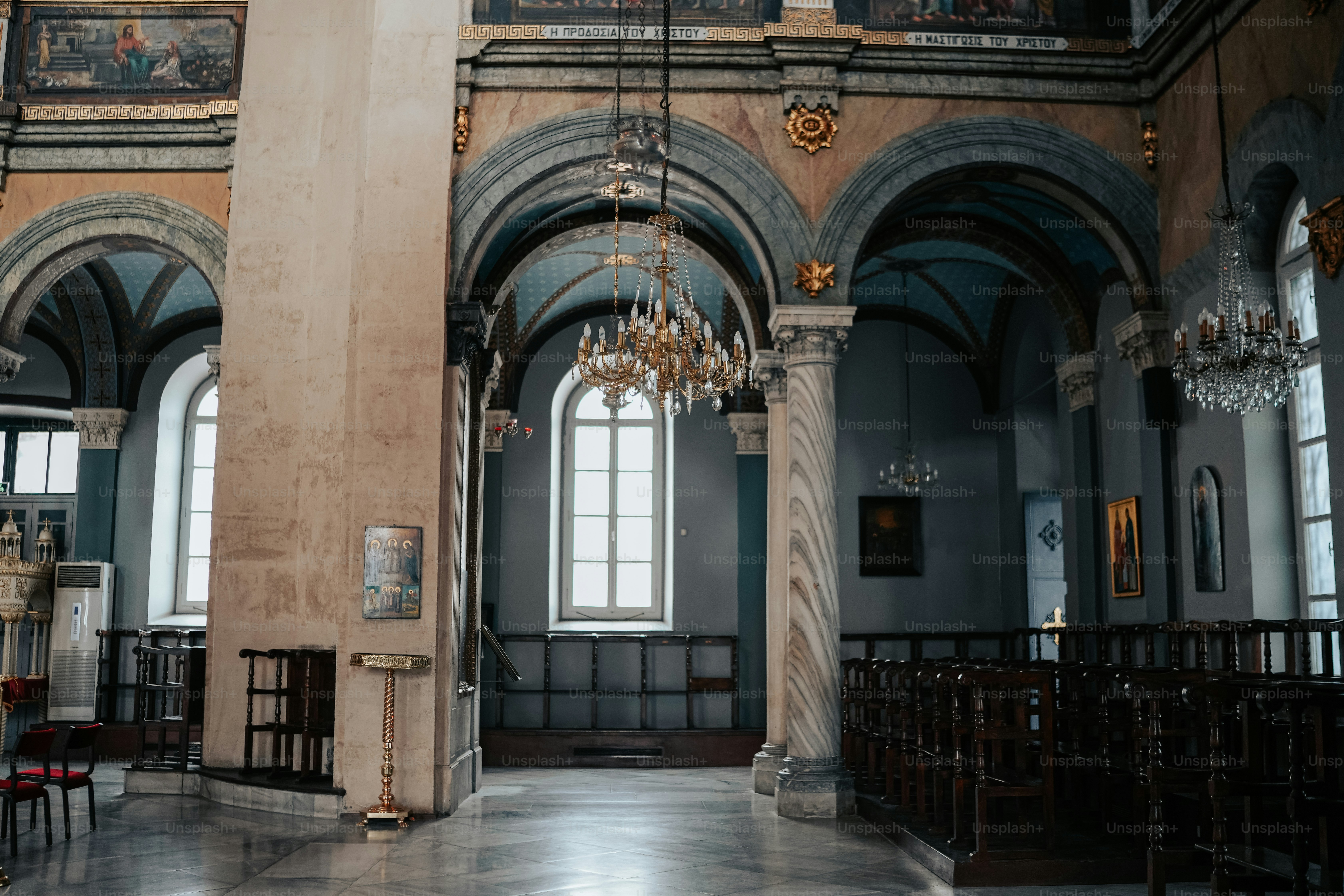 a large room with a chandelier hanging from the ceiling