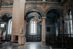 a large room with a chandelier hanging from the ceiling