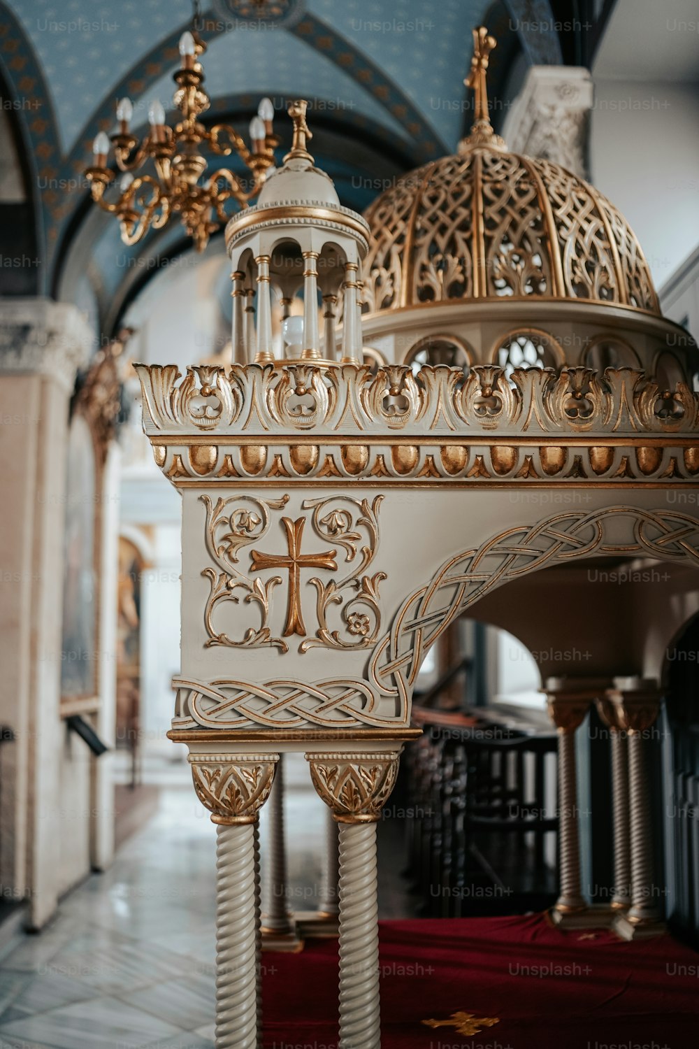 a church with a cross on the alter