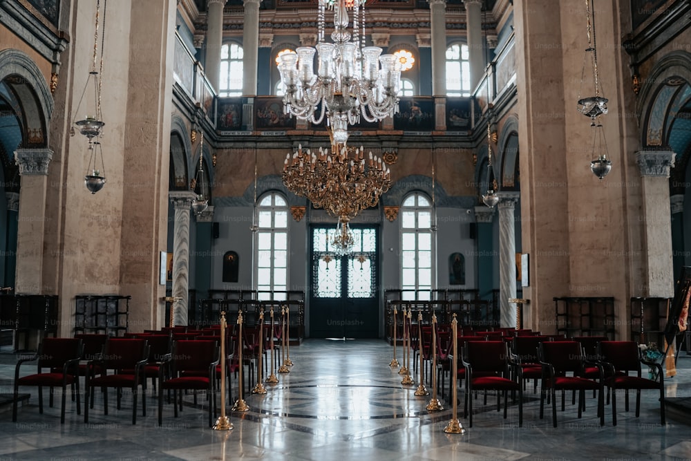 a chandelier hanging from the ceiling of a large building