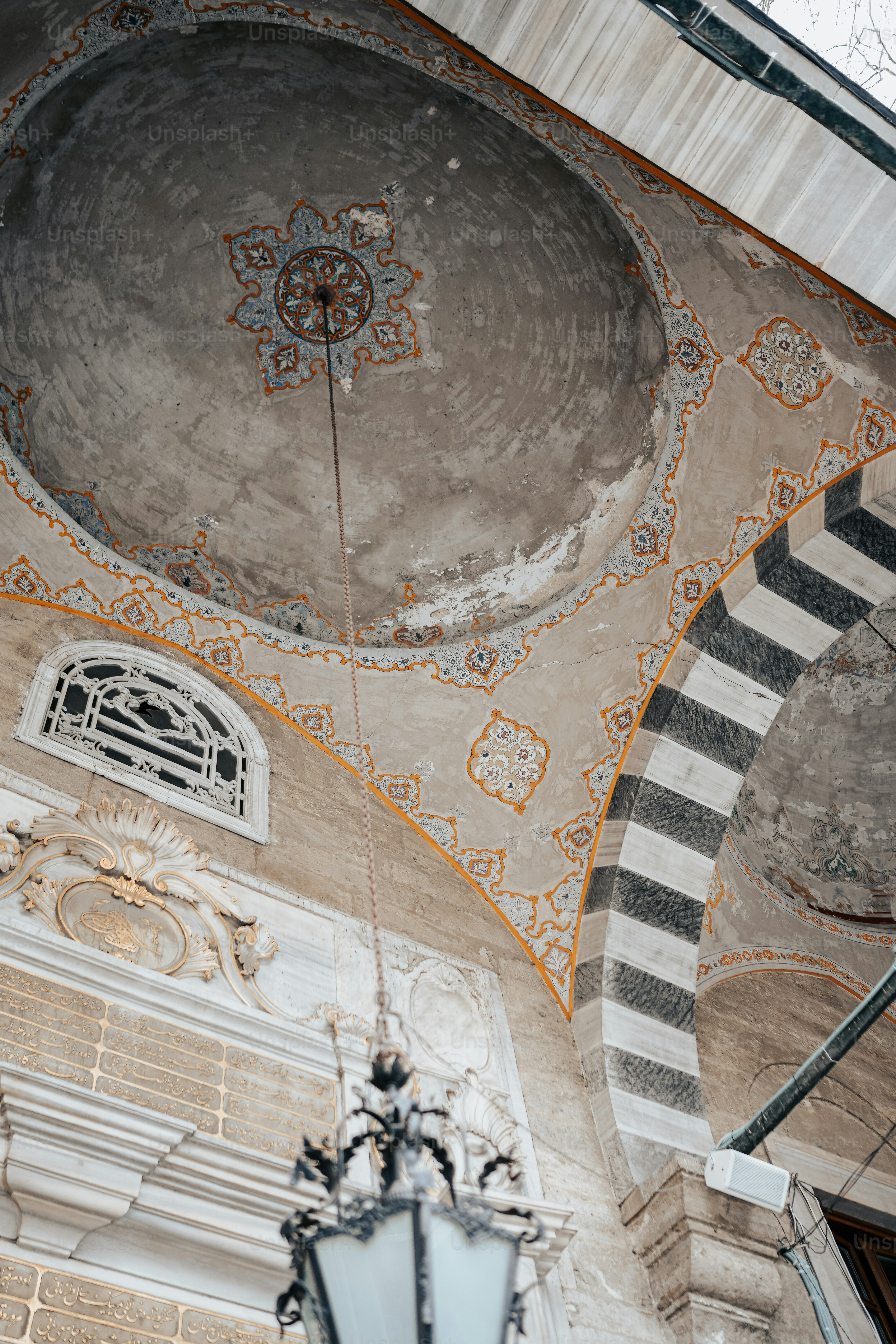 a light hanging from the side of a building
