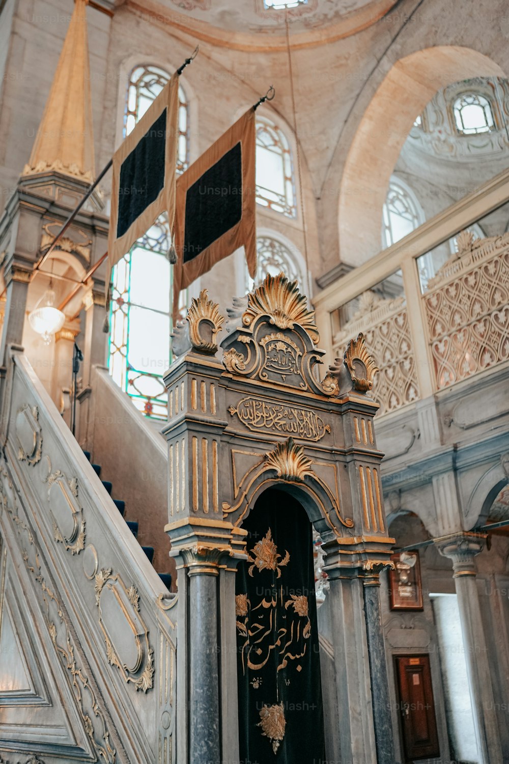 a staircase in a building with a clock on it