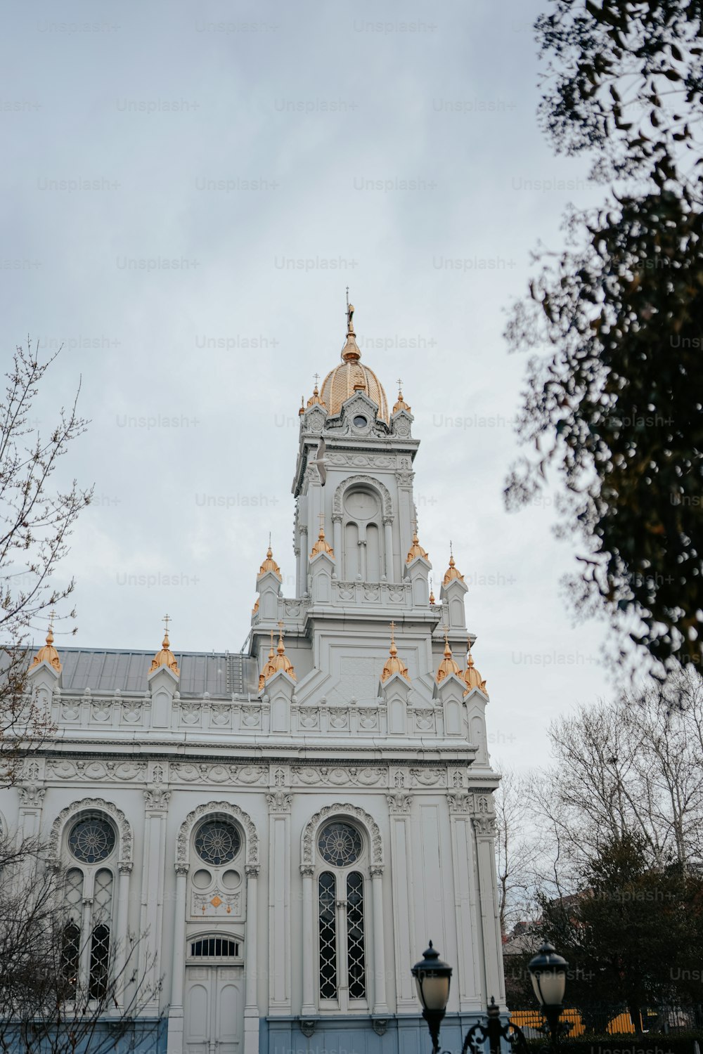 a large white building with a clock tower