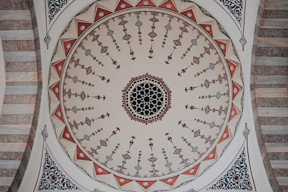 a ceiling with a circular design on it