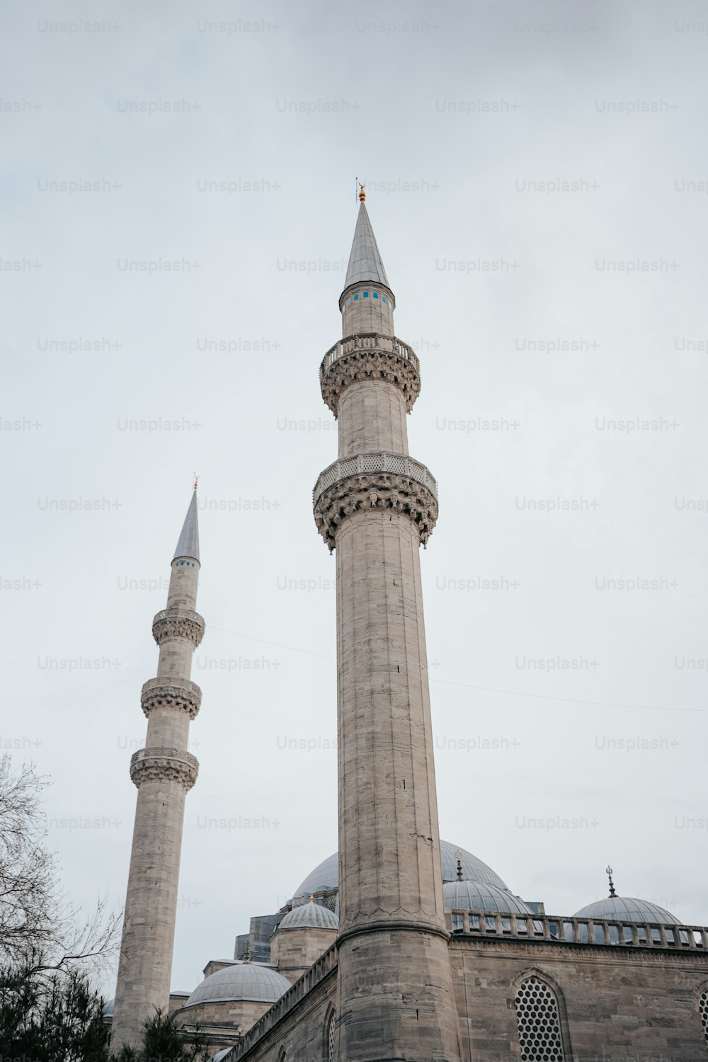 a tall building with two towers on top of it