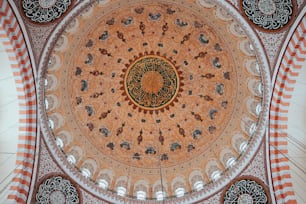 the ceiling of a building with a circular design