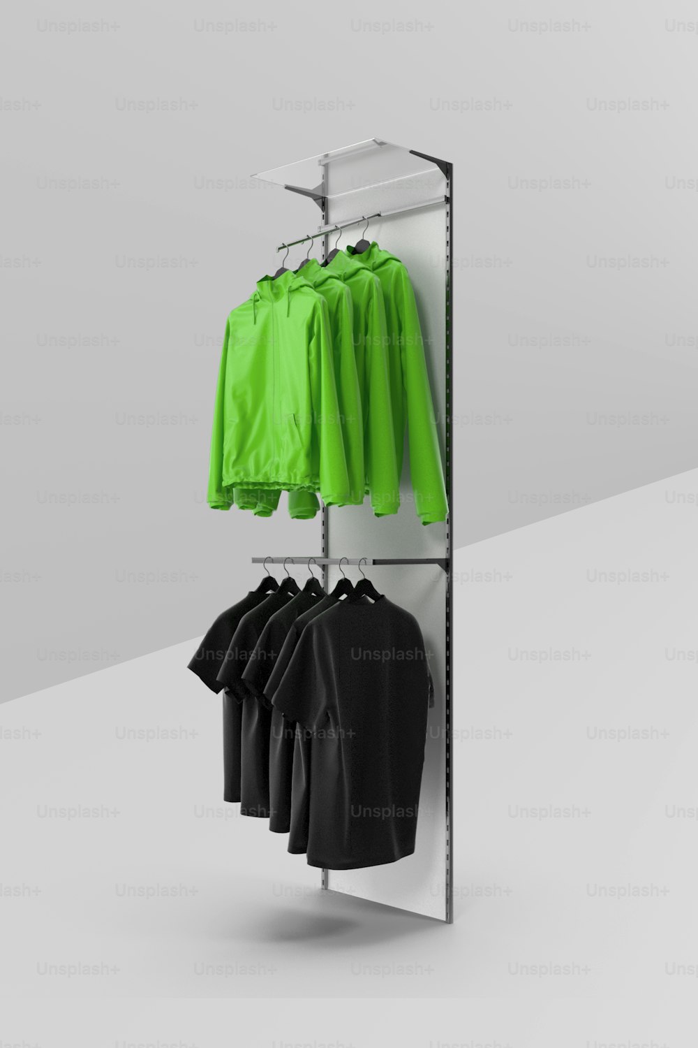 a clothes rack with green and black shirts