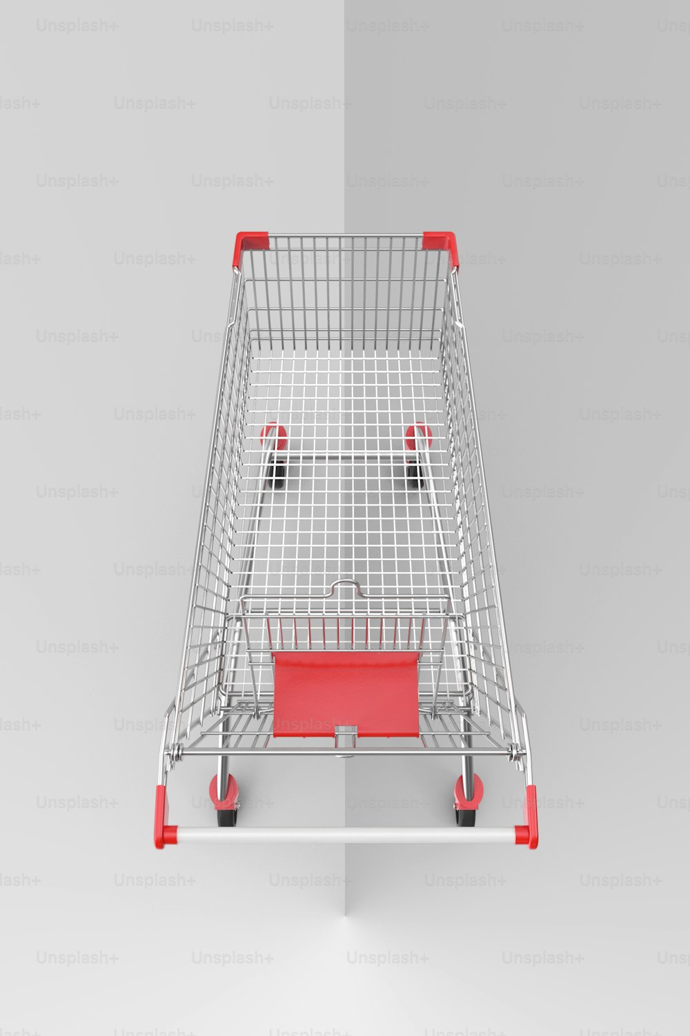 um carrinho de compras com uma alça vermelha em um fundo cinza