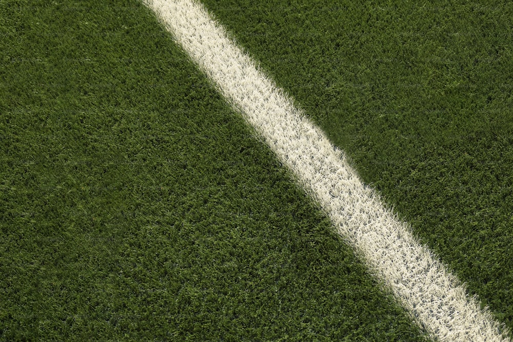 a white line on a green grass field