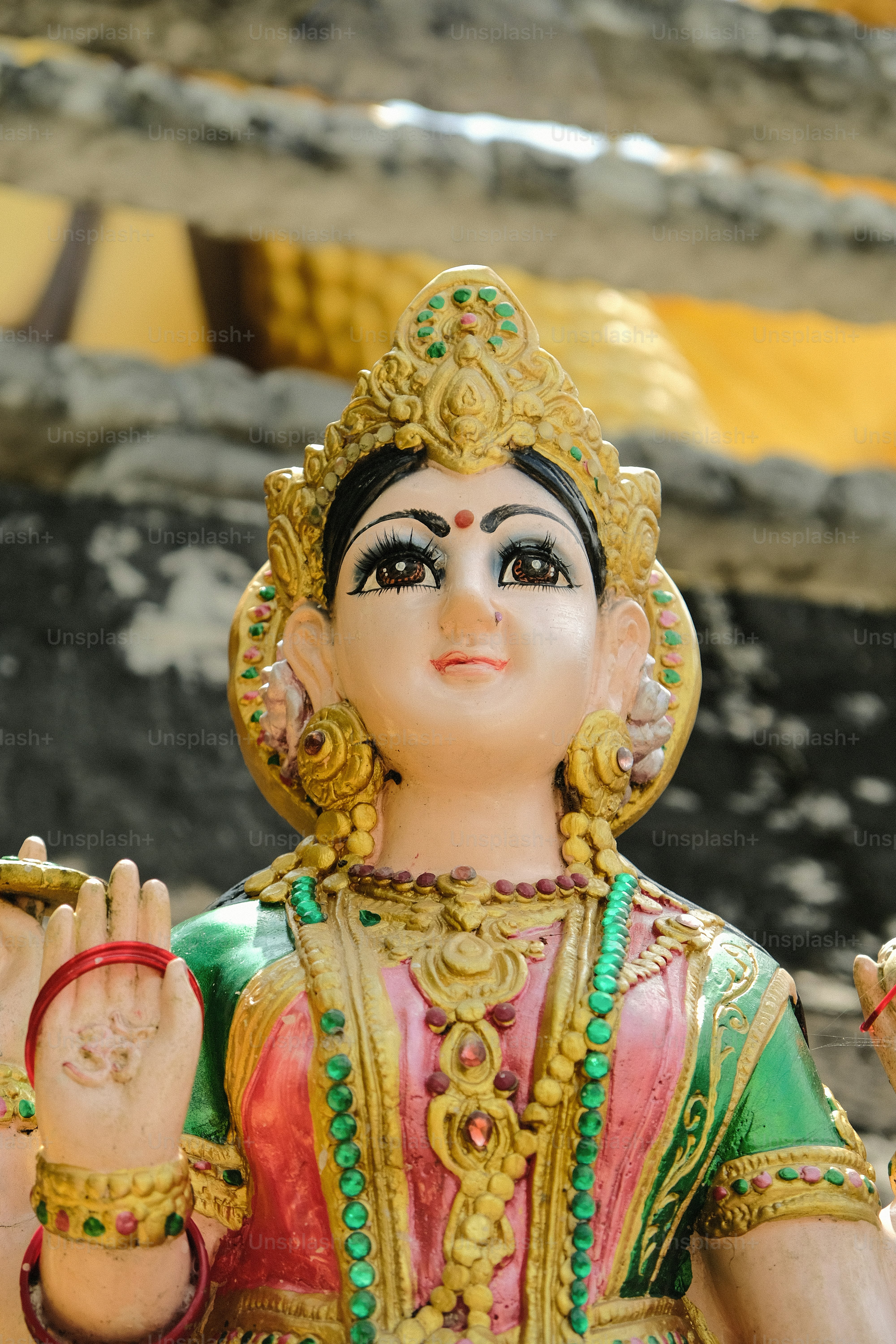 a statue of a person with a hand up