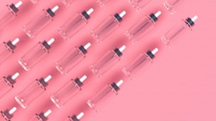 a pink background with a row of glass tubes