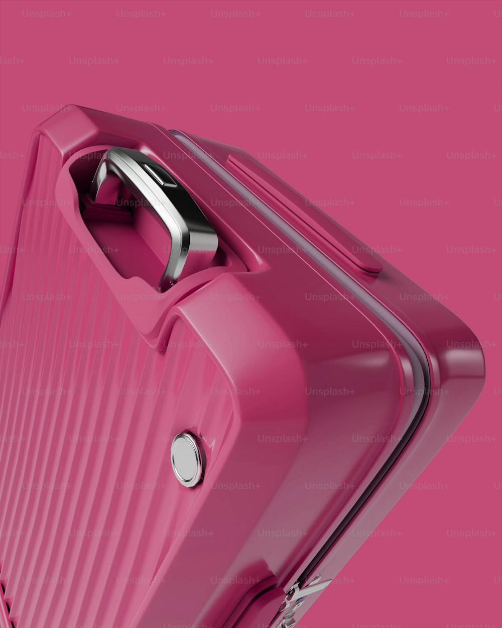 a pink piece of luggage on a pink background