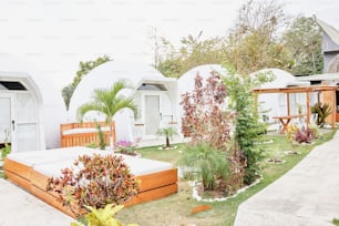 a garden area with a bed and a wooden bench