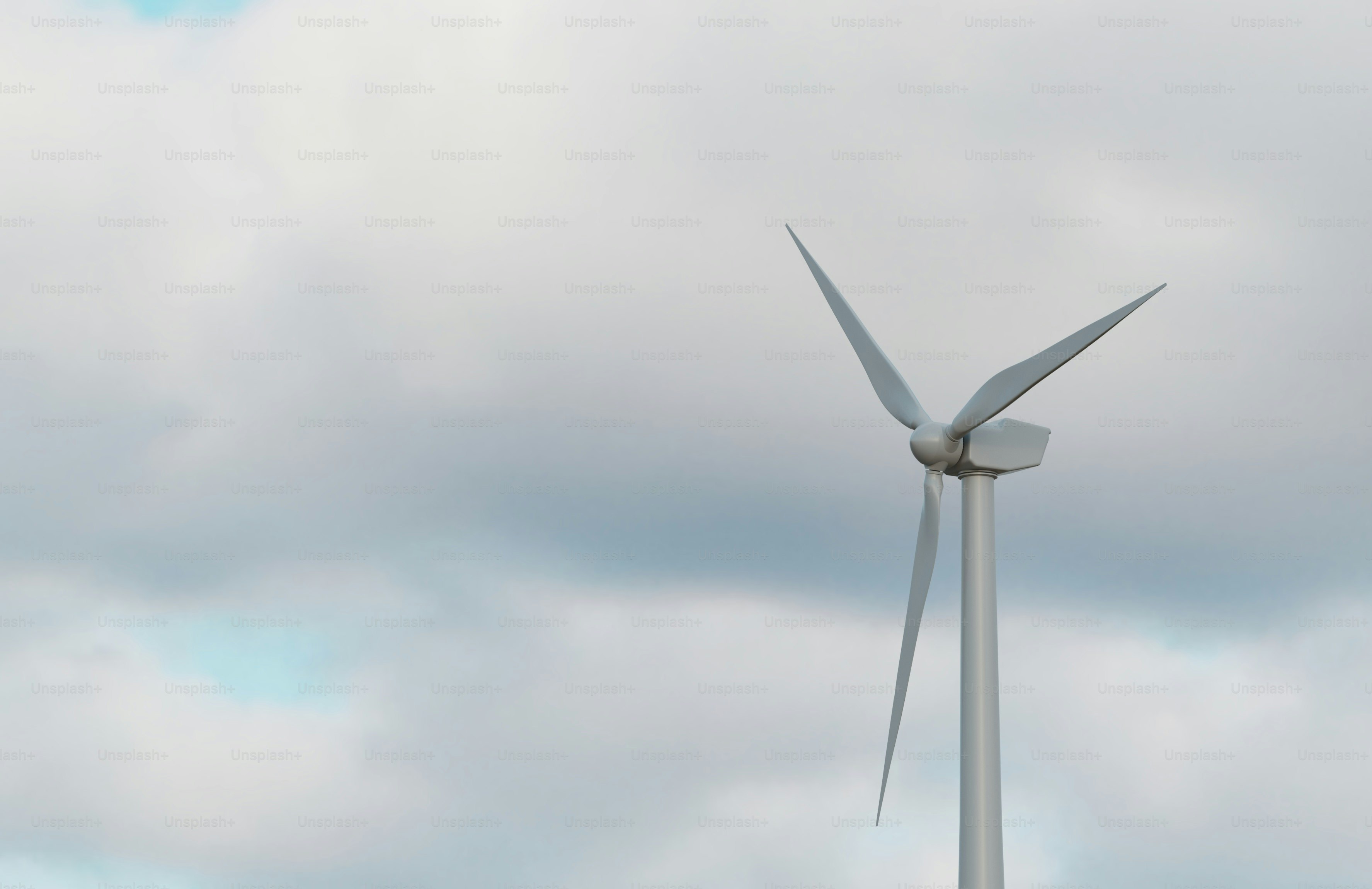 A wind turbine on a cloudy day photo – Renewables Image on Unsplash