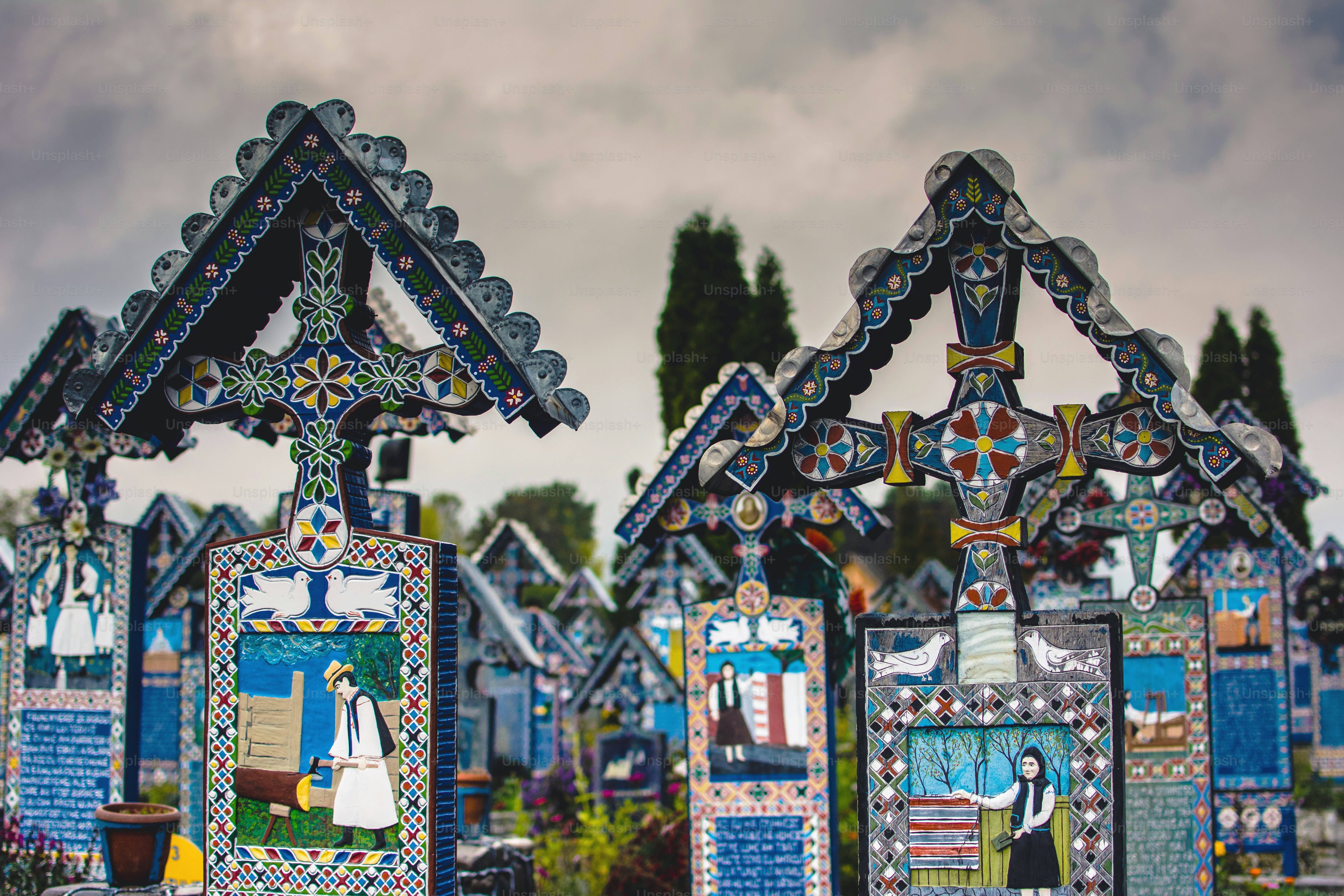 a row of colorfully painted wooden houses on a cloudy day