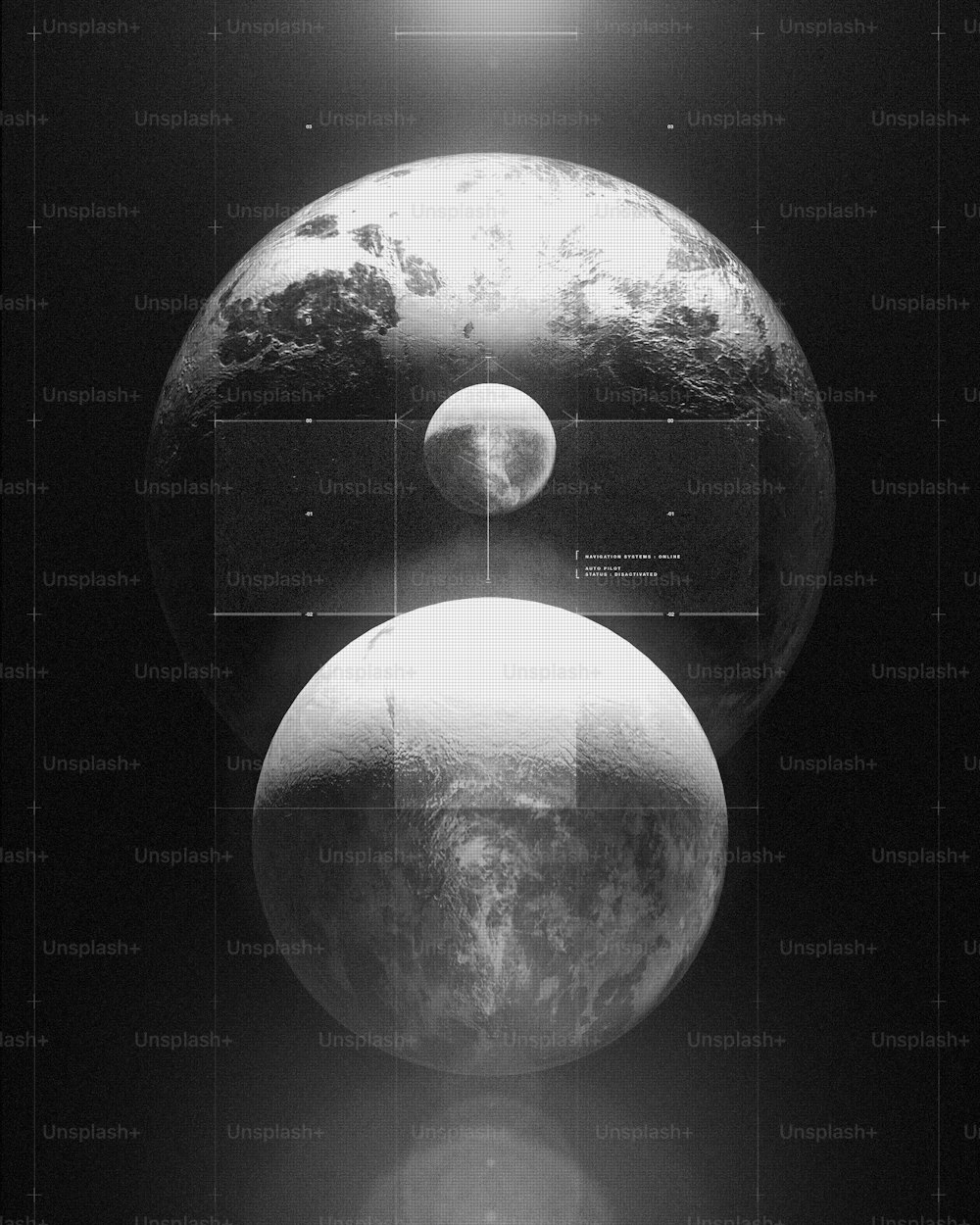 a black and white photo of two planets