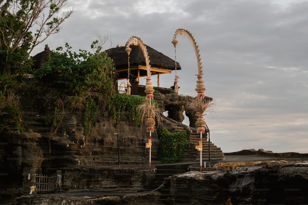 a stone structure with a spiral design on top of it