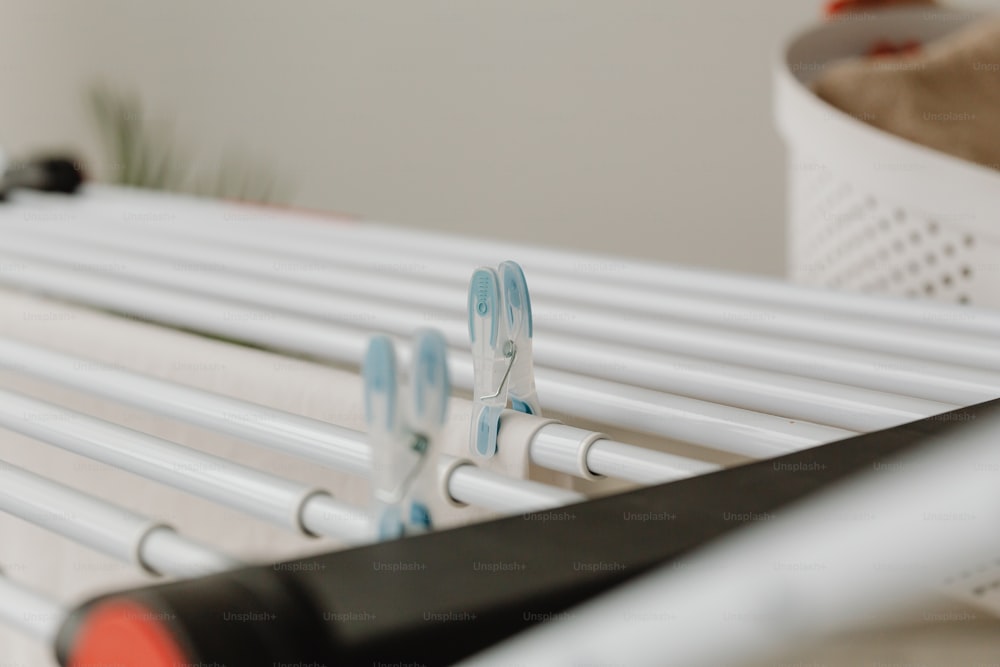 a close up of toothbrushes and toothpaste on a rack