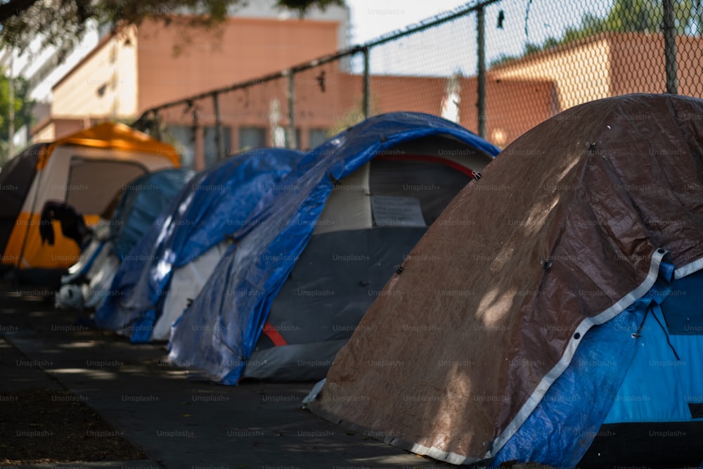 a row of tents sitting on the side of a road