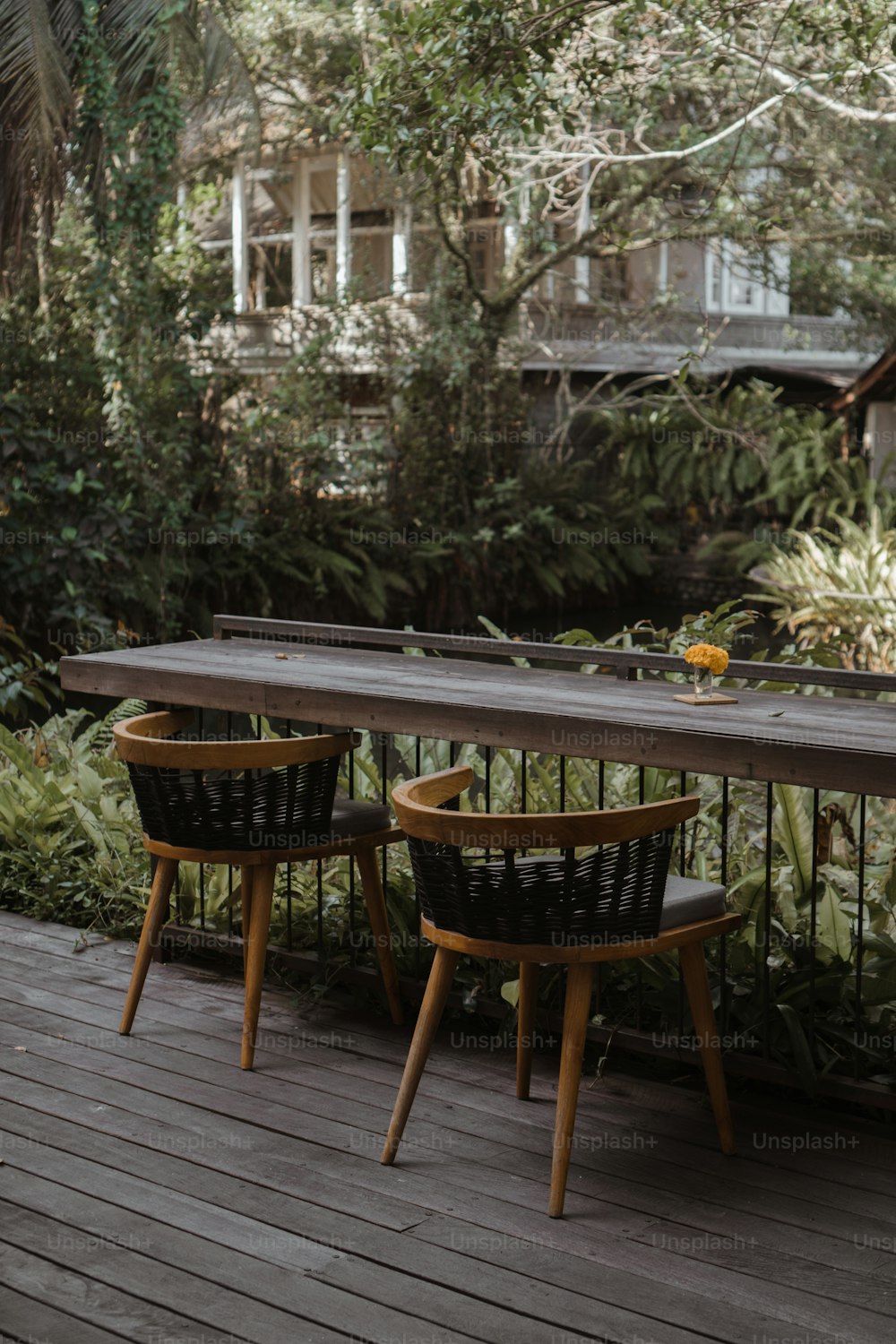 a table and chairs on a wooden deck