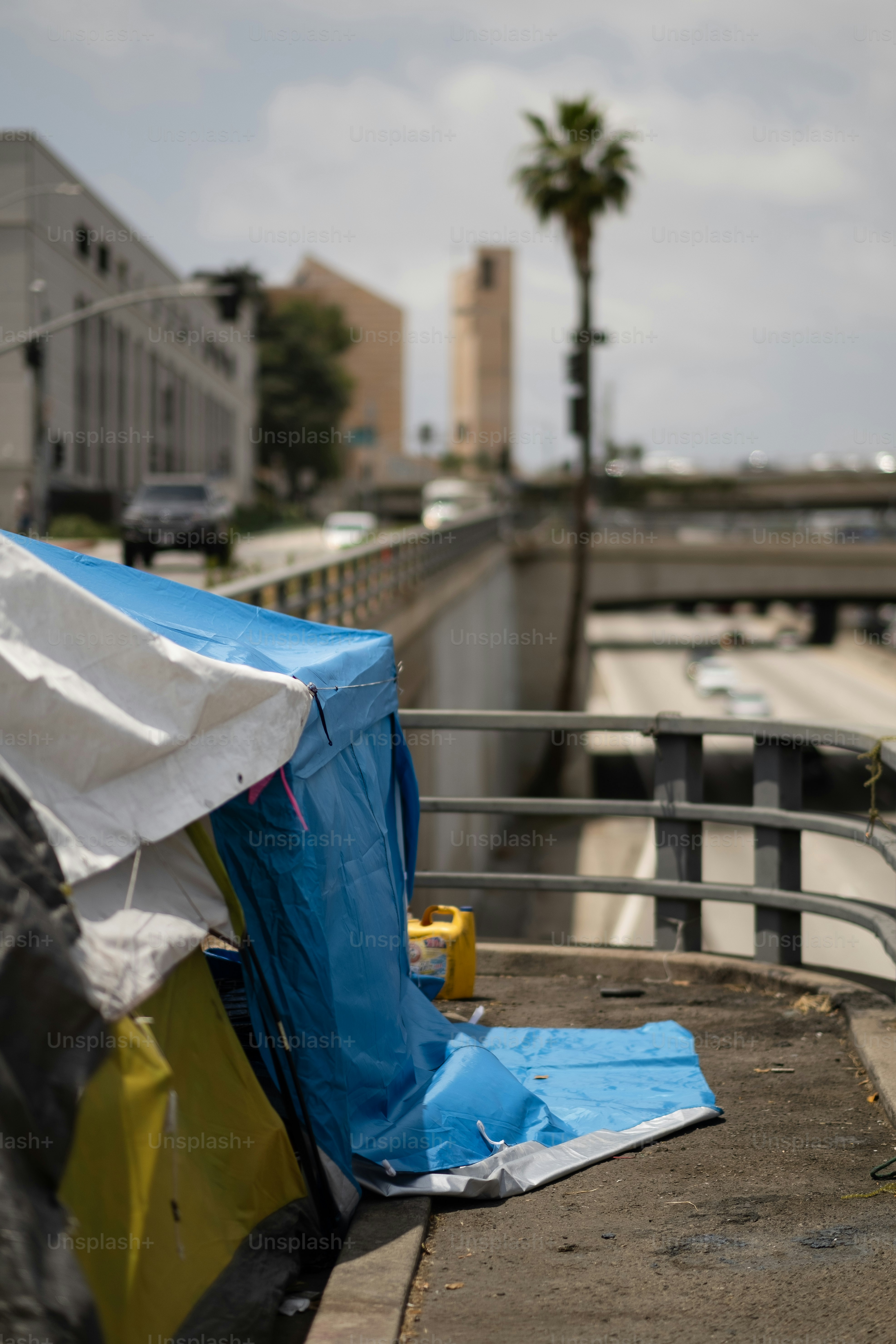 a blue tarp covering a yellow fire hydrant