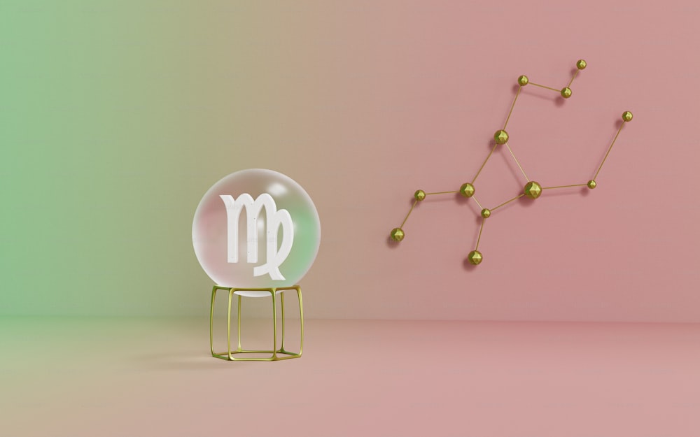 a chair sitting next to a zodiac sign on a pink and green background