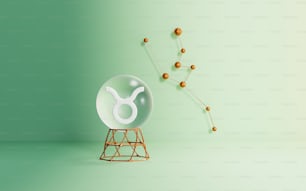une sphère de verre avec un signe du zodiaque dessus