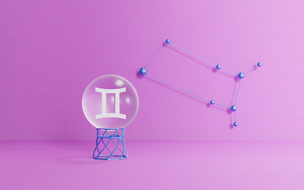 a glass ball with a letter on it next to a purple background