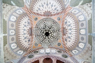 the ceiling of a building with a circular design on it