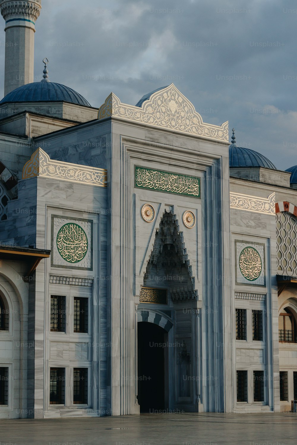 a large white building with a blue dome