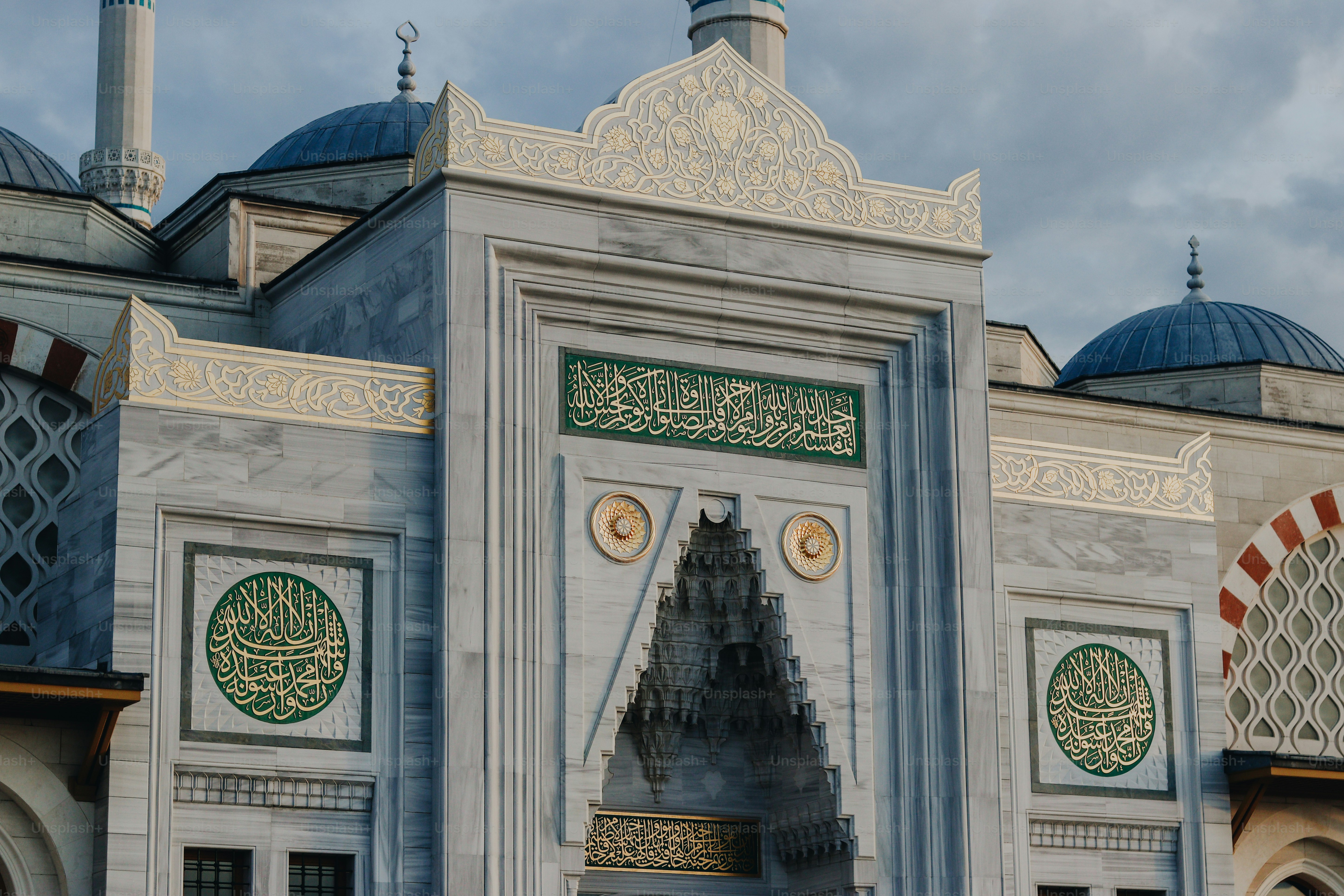 a large white building with a clock on it's side