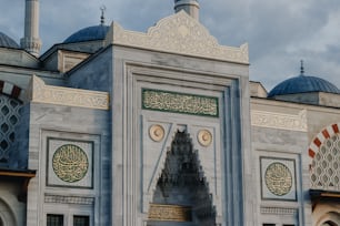 a large white building with a clock on it's side