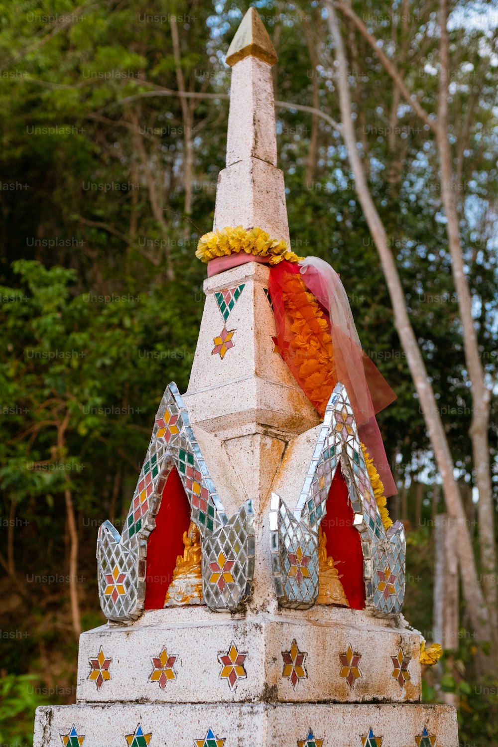 a statue of a person with a crown on top of it