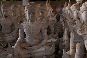 a group of white statues sitting next to each other