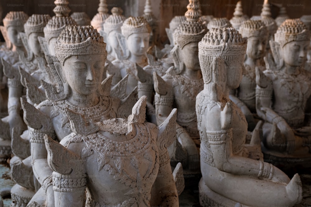 a group of statues of various sizes and shapes