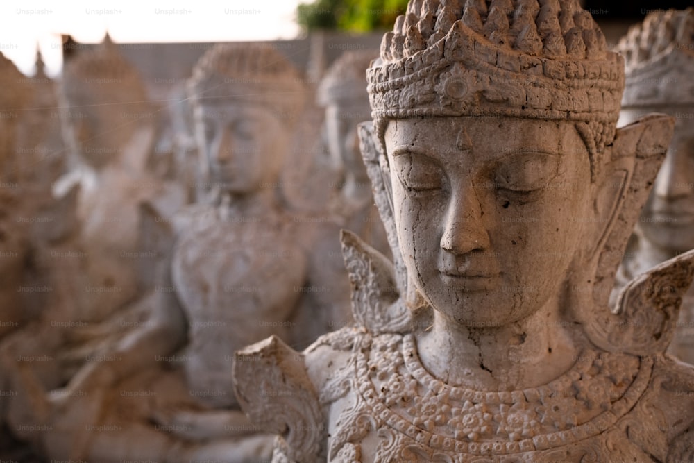 a group of statues sitting next to each other