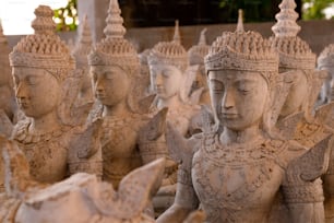 a group of statues of various sizes and shapes