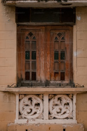 a window with a wooden frame and two windows