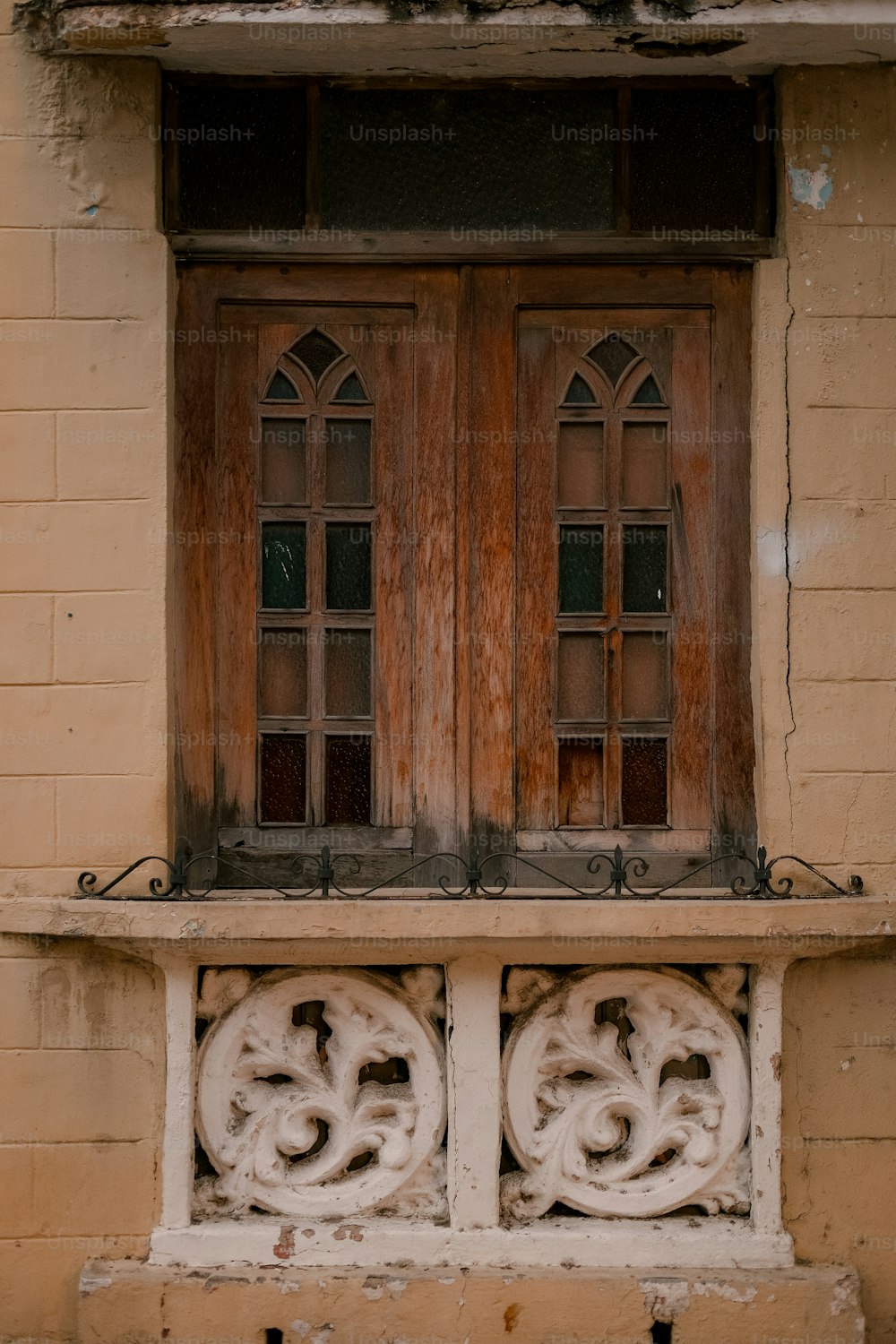 a window with a wooden frame and two windows