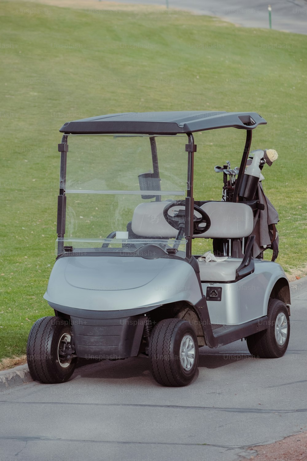 a golf cart parked on the side of the road