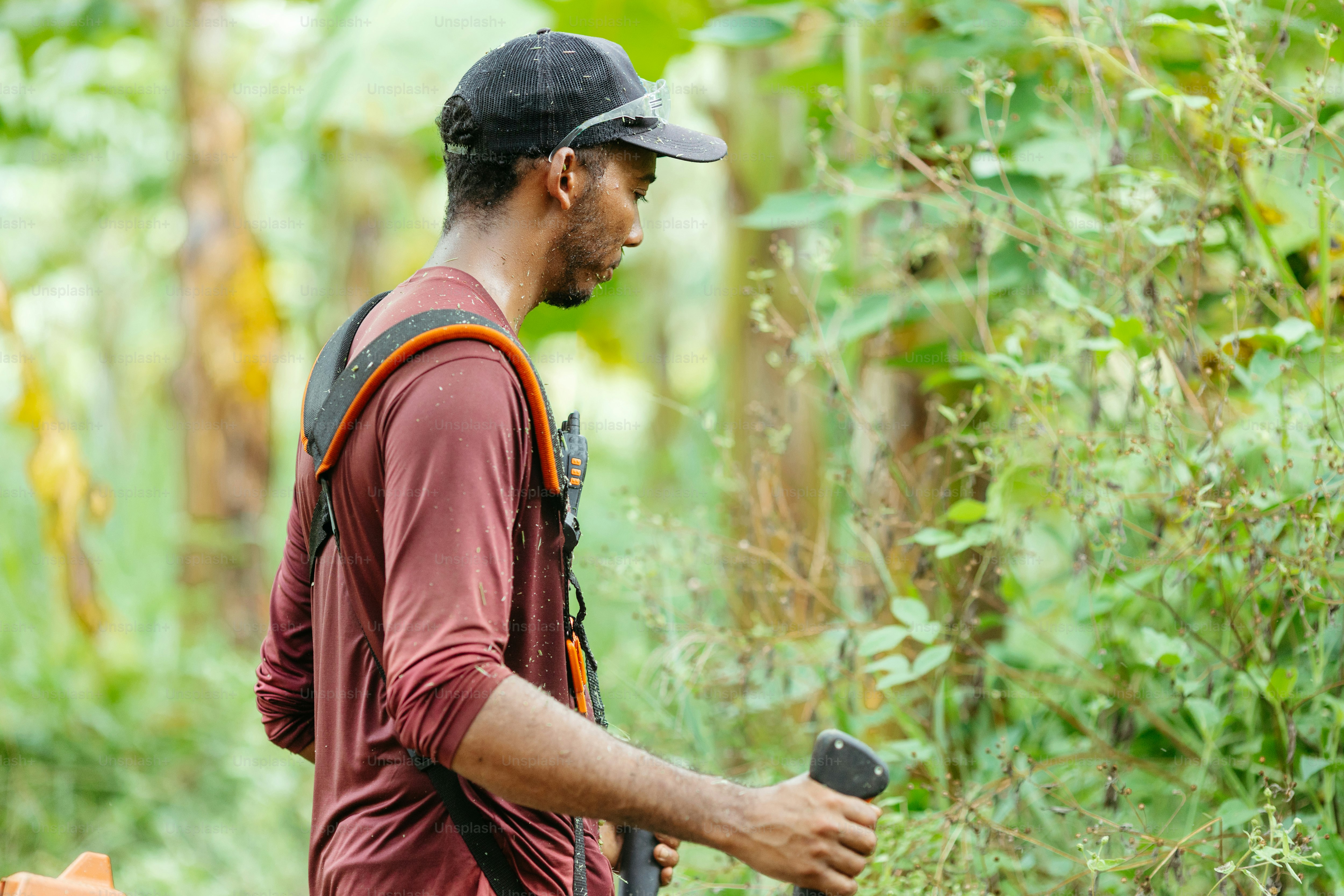 a man with a backpack is walking through the woods