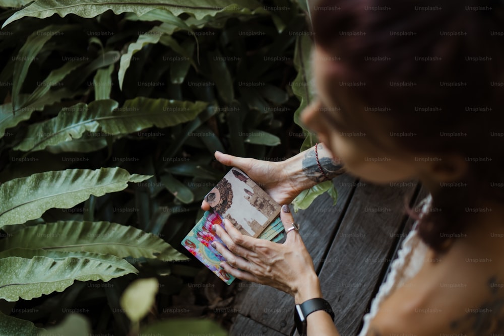 a woman holding a book in her hands